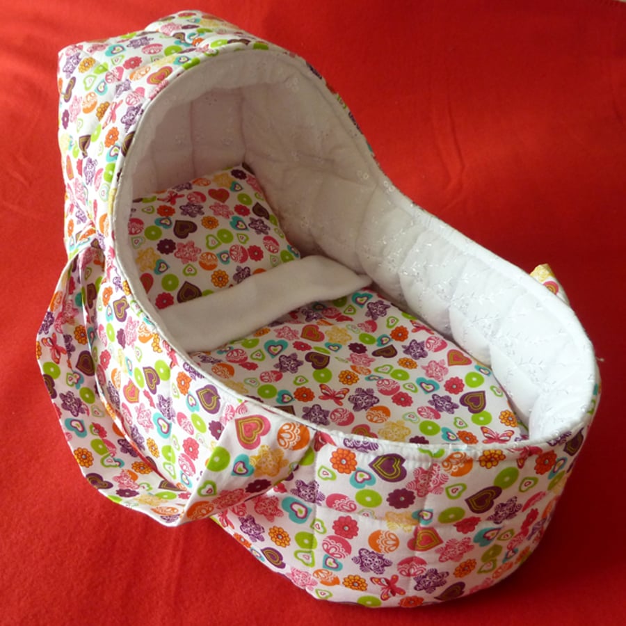 Large multi-coloured Doll's Carrycot