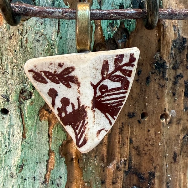 Small triangular brown sea pottery pendant 