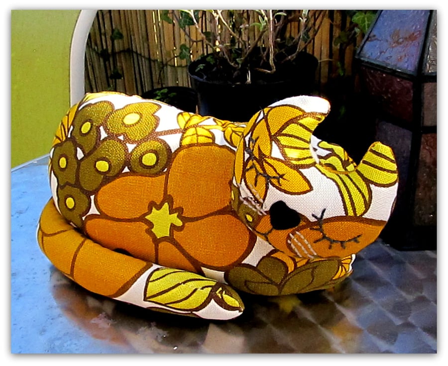 Snoozy cat doorstop,  Marigold.  1970s flowerpower.