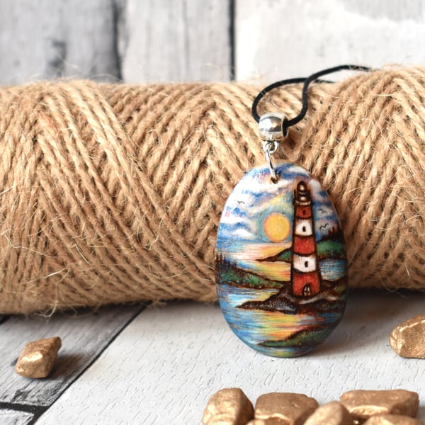 Pyrography lighthouse sunrise wooden pendant.