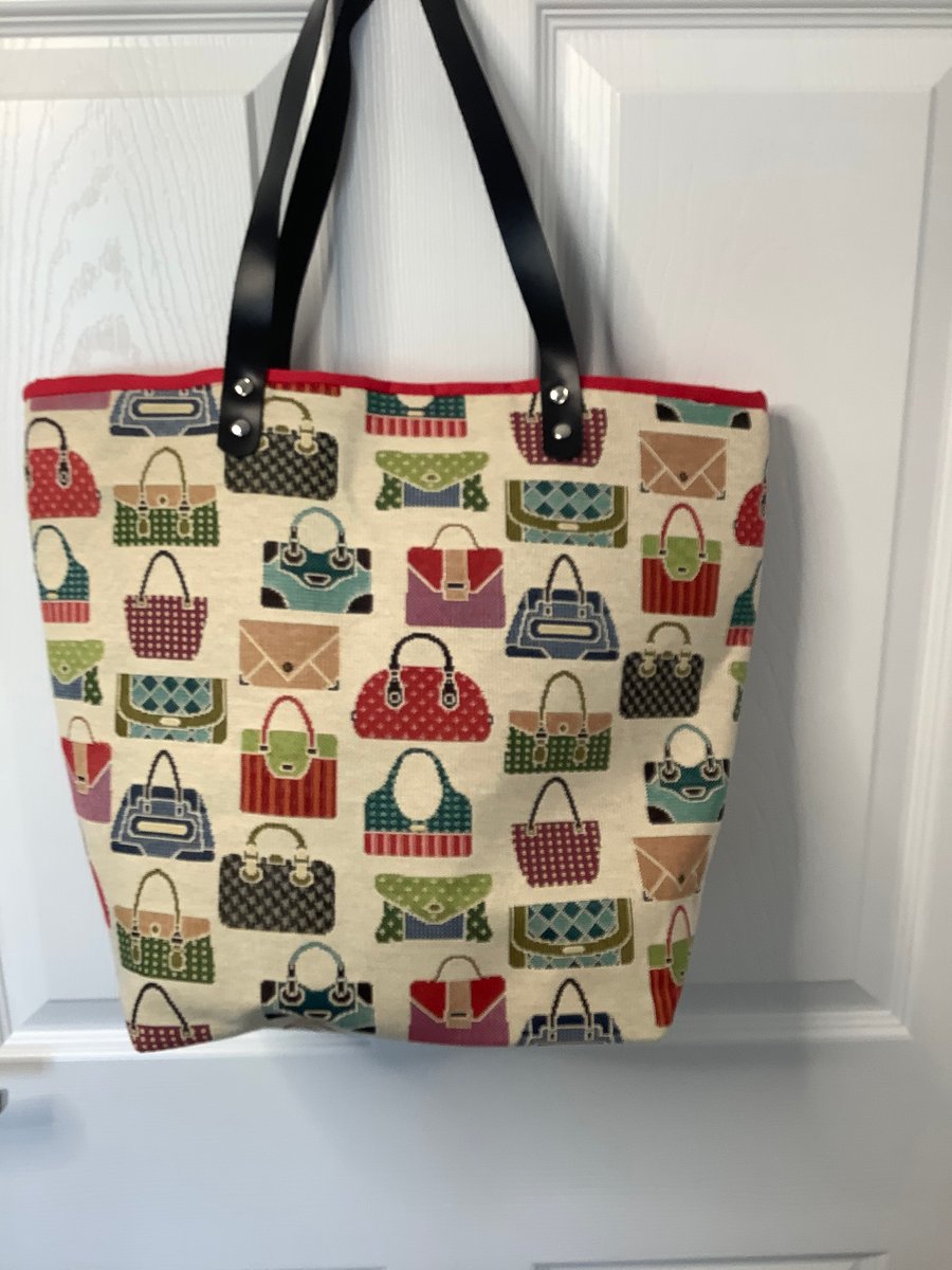 Attractive tote bag with Handbag design  and fully lined ,brown leather handles