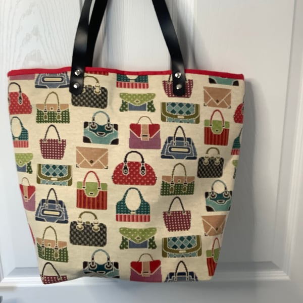 Attractive tote bag with Handbag design  and fully lined ,brown leather handles