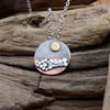 Silver and copper pebble beach pendant