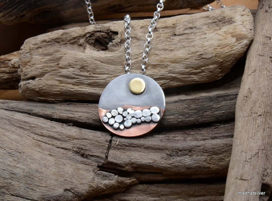Silver and copper pebble beach pendant
