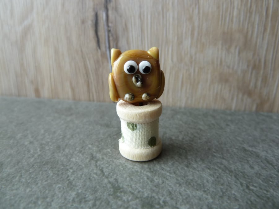 wooden spool with owl