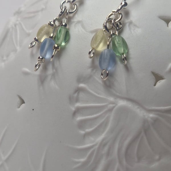 Delicate sterling silver and pastel blue, green and yellow pinch bead earrings. 