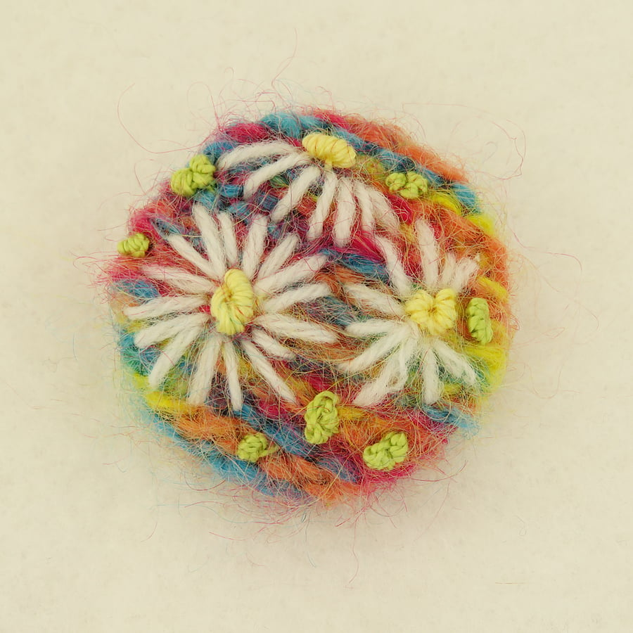 Daisy Brooch embroidered on knitted multi citrus background