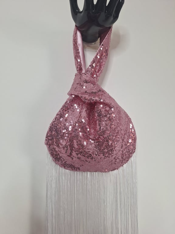 Pink sequin Japanese Knot bag with 27cm tassel trim and satin lining.
