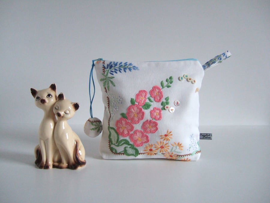 Make up bag or pouch made from an embroidered vintage table cloth. 