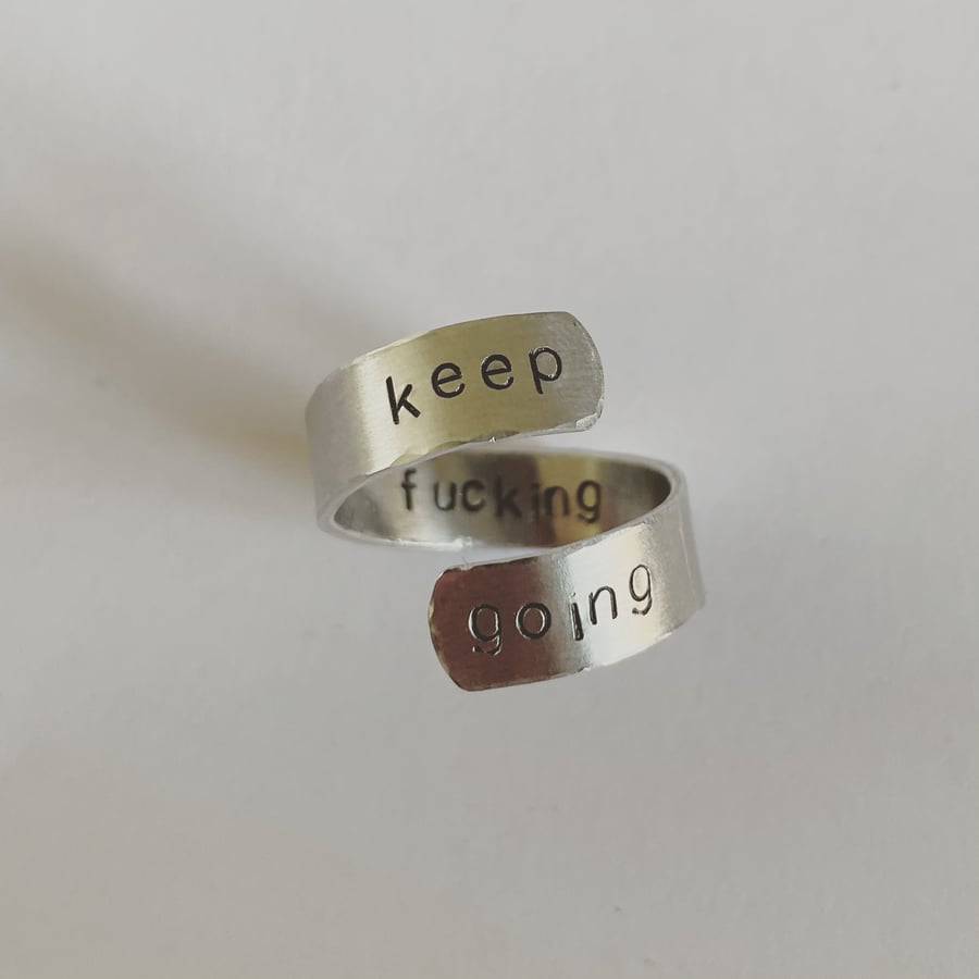 Wrap metal ring stamped with ‘keep going’