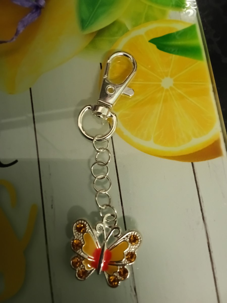 Silver butterfly bag charm with yellow crystals, cute!