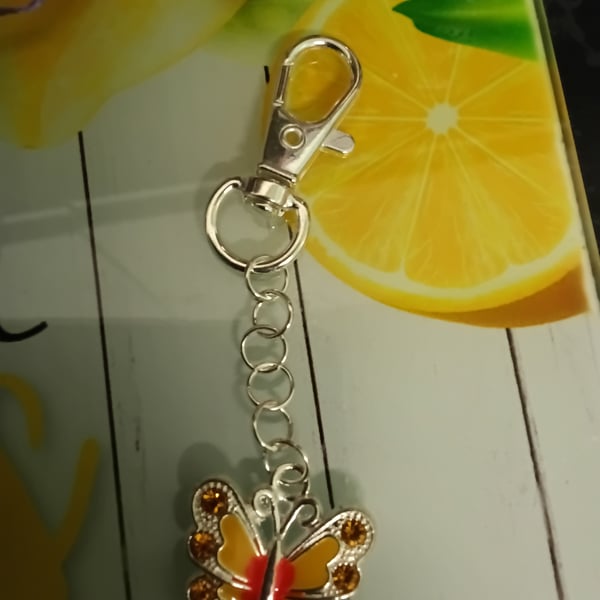 Silver butterfly bag charm with yellow crystals, cute!