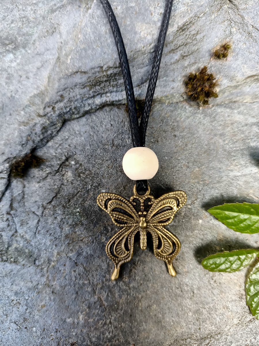 Antique brass Butterfly charm and wood pendant necklace