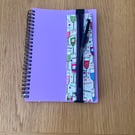 Pen or pencil holders for A5 notebooks or journals.