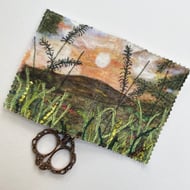 Sunset countryside sewing needle and pins case. 