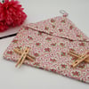 Peg bag in pink and white floral fabric.  