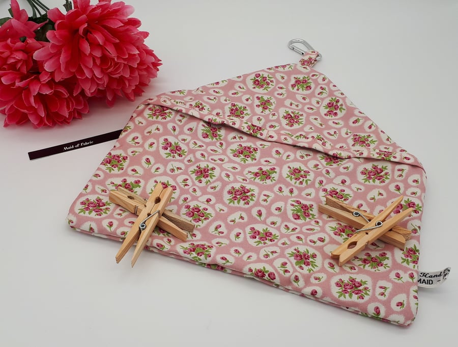 Peg bag in pink and white floral fabric.  