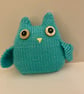 Knitted green owl with moving button eyes