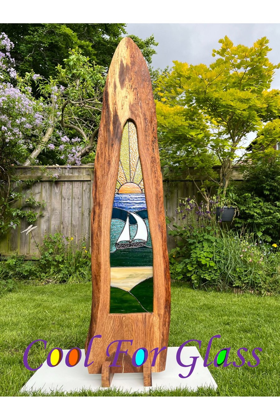 Tall stained glass sailing at sunset in brown oak ethically sourced frame. 
