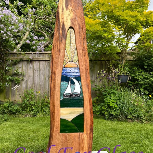 Tall stained glass yacht  scene at sunset in brown oak ethically sourced frame. 