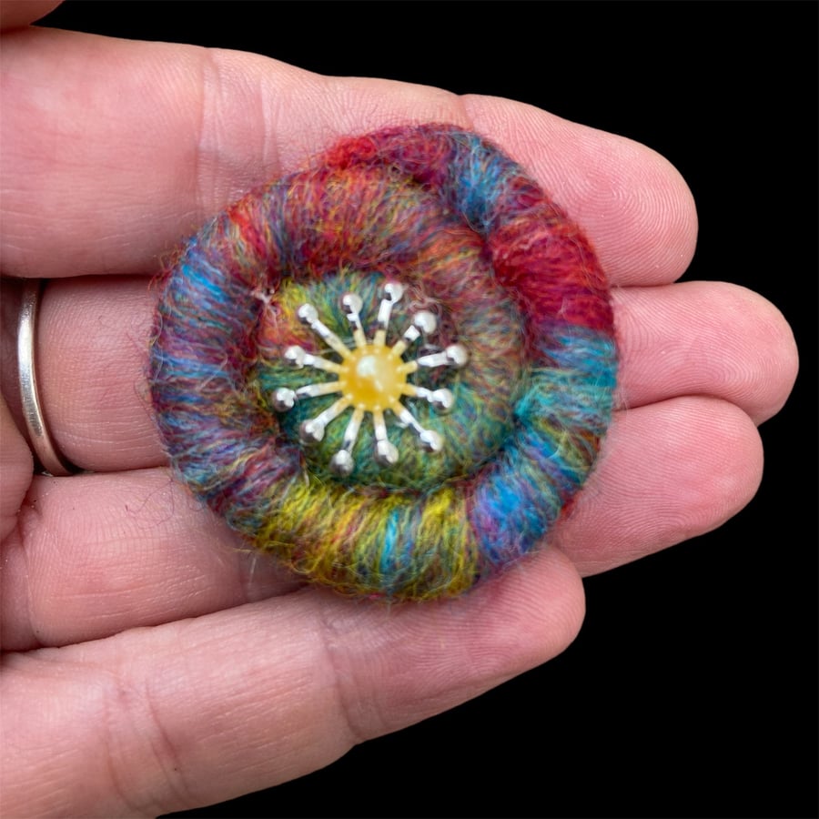 Needle felted multicoloured spiral brooch