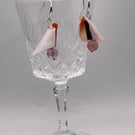 Peach and black curled shell drop earrings
