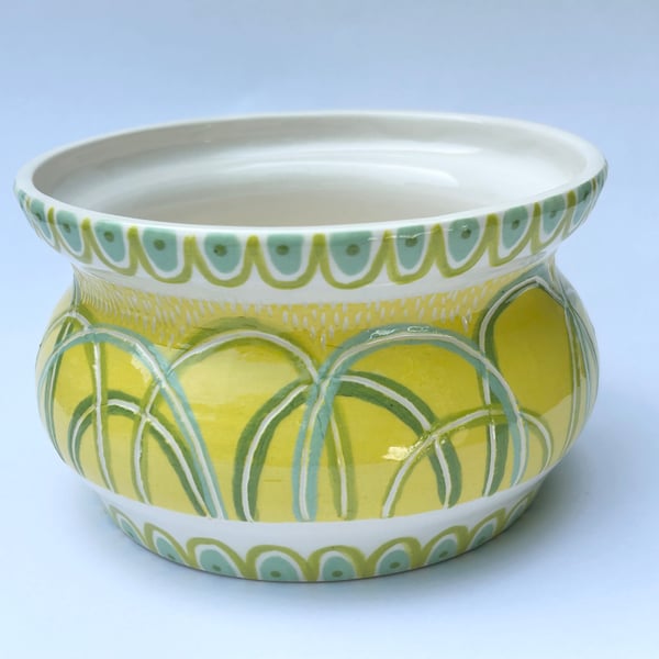 Ceramic hand thrown pot with unique yellow design