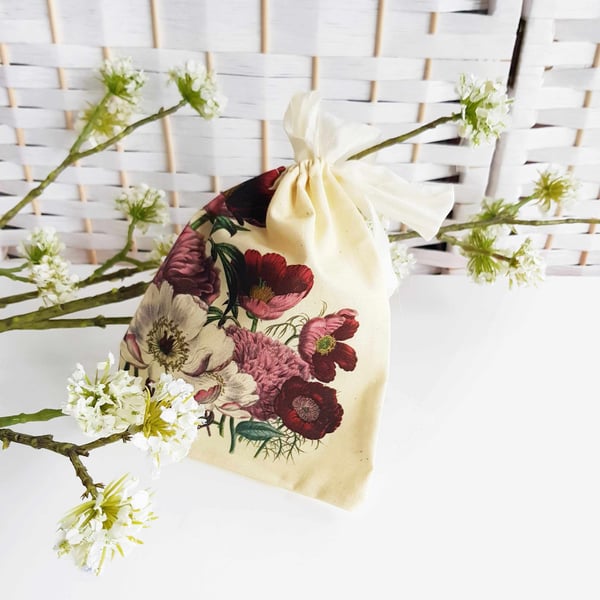 Organic cotton gift bag with botanical peony print and silk drawstring.