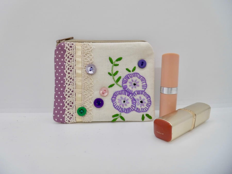 Coin purse made with upcycled embroidered linen.