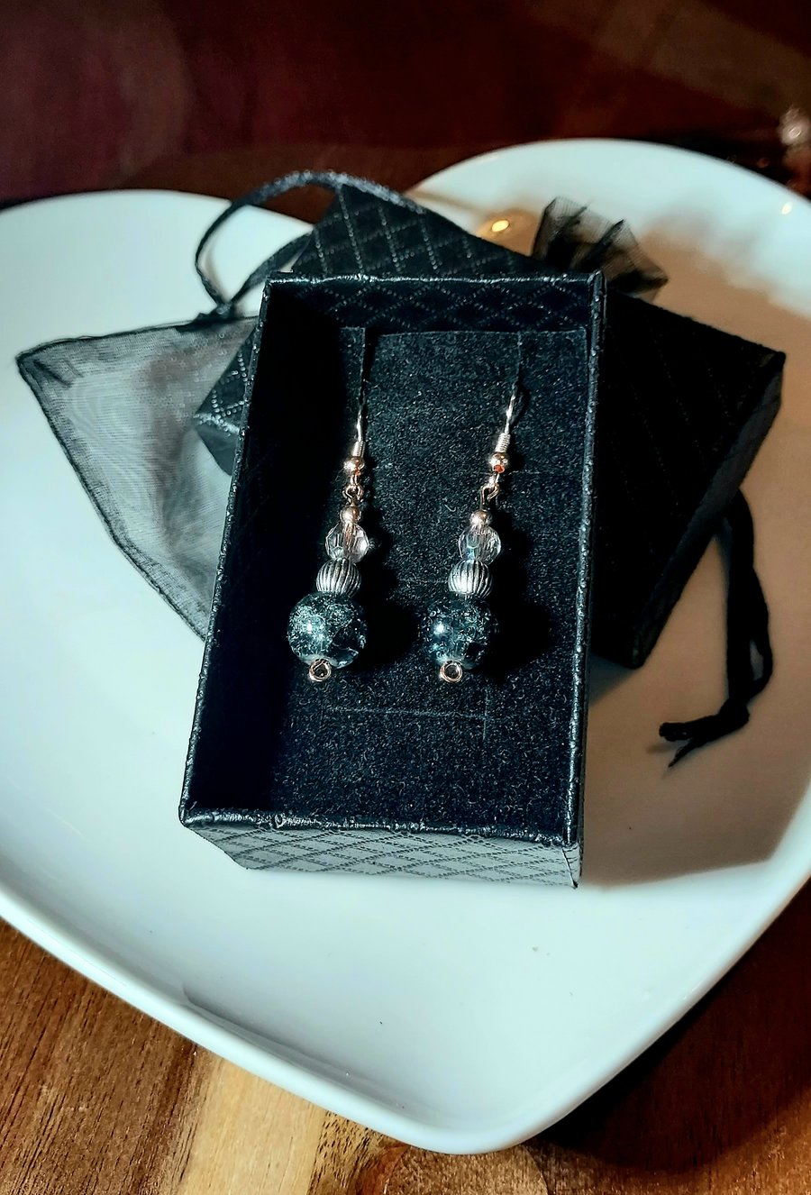 Hypoallergenic beaded earrings with silver and pewter tones. 