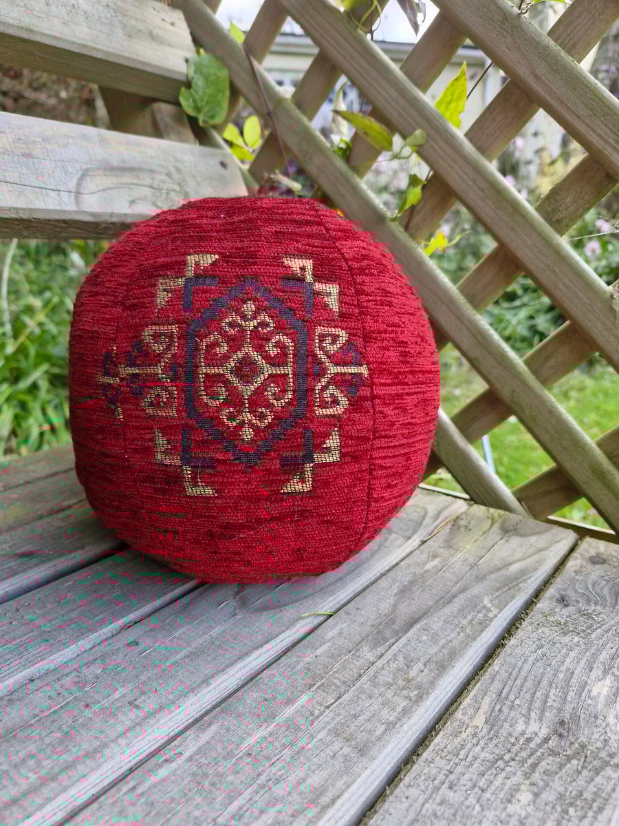 Large, decorative, red and gold fabric ball. Could be doorstop or decorative.