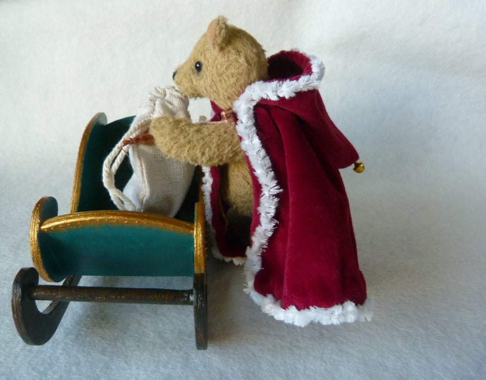 Santa, a collectable unique mini bear in his Christmas sleigh.