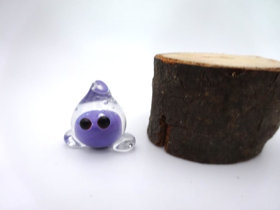 small glass wisp figure