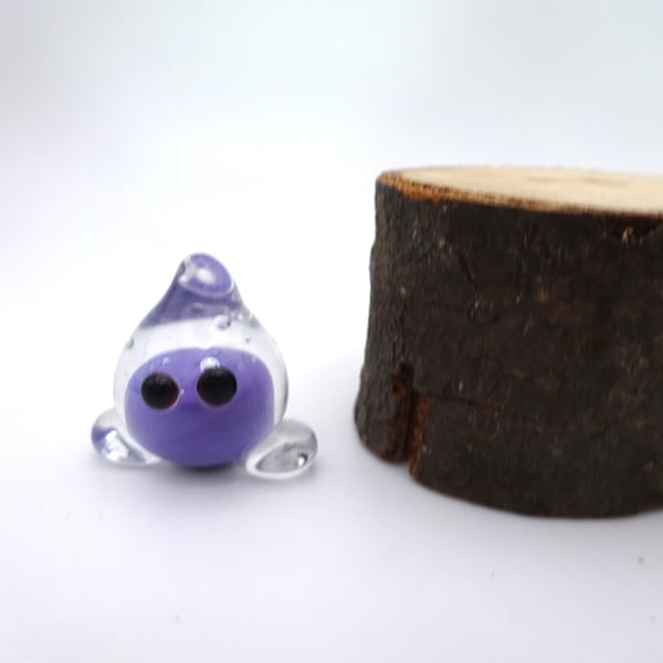 small glass wisp figure