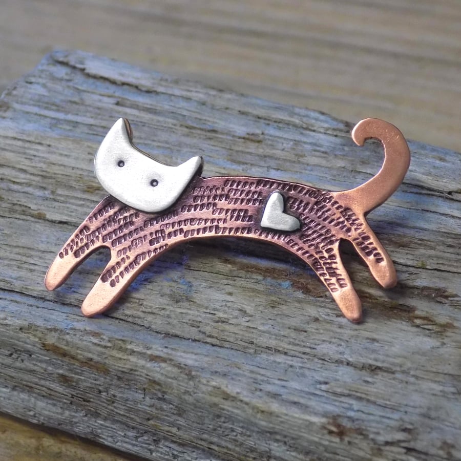 Copper and silver leaping cat mixed metals brooch