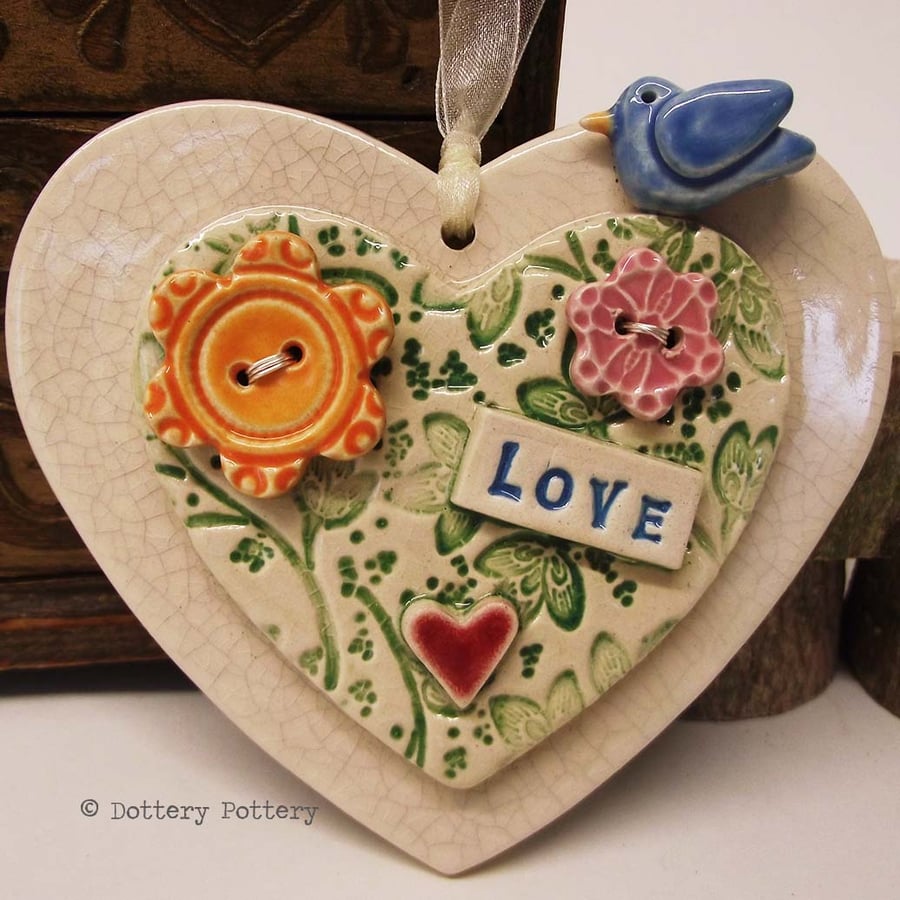  Ceramic heart decoration with flower buttons and pottery bird