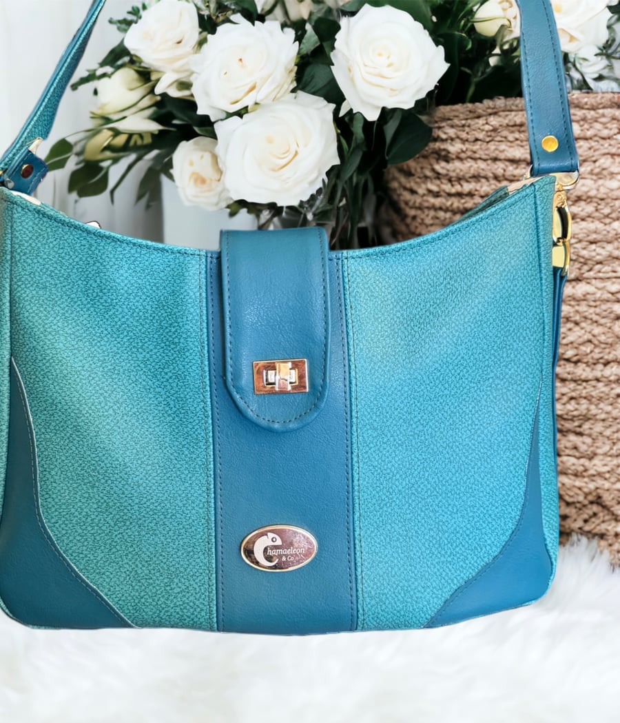 Shoulder bag in two tone teal faux leather 