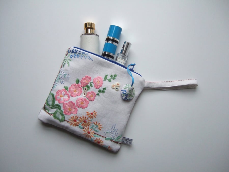 Clutch bag or make up bag  made from an embroidered  vintage tablecloth