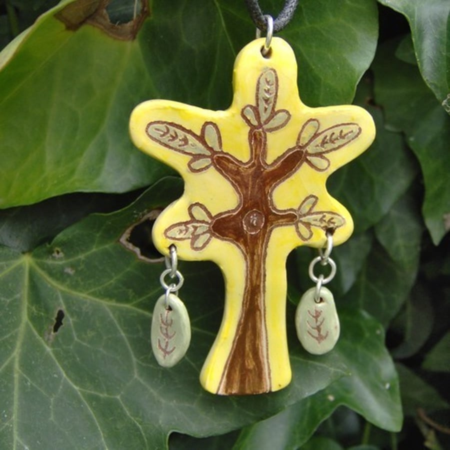 Tree with dangly leaves. Ceramic pendant.