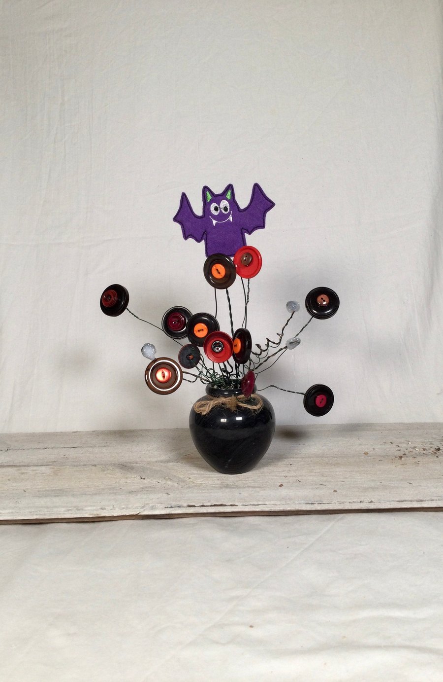 Small handmade button bouquet ornament for Halloween. Seasonal ornament. Handmad