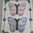 Wooden butterflies on canvas. 