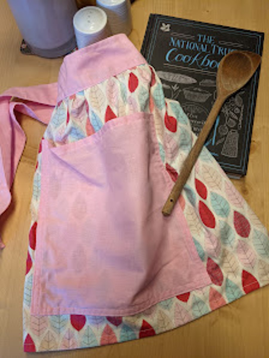 Waitress or barista-style half-apron with pink leaf design
