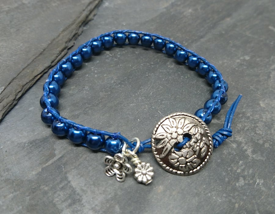 Navy leather and glass pearl bracelet with floral button
