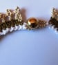 A crocheted necklace in white, coffee and cream cotton with edging of gold beads - Image 4