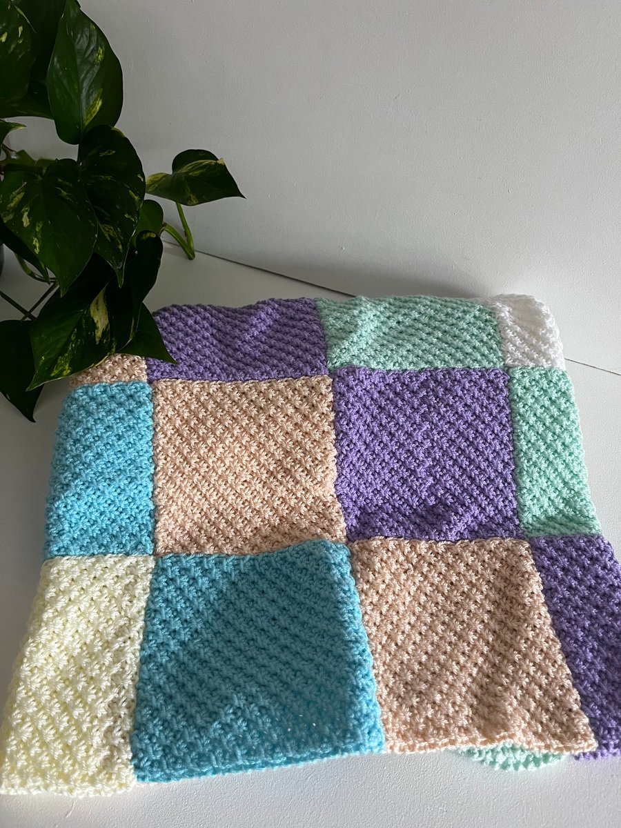 hand knitted pastel patchwork blanket