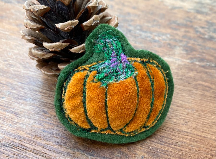 Upcycled Halloween pumpkin brooch pin or badge. 