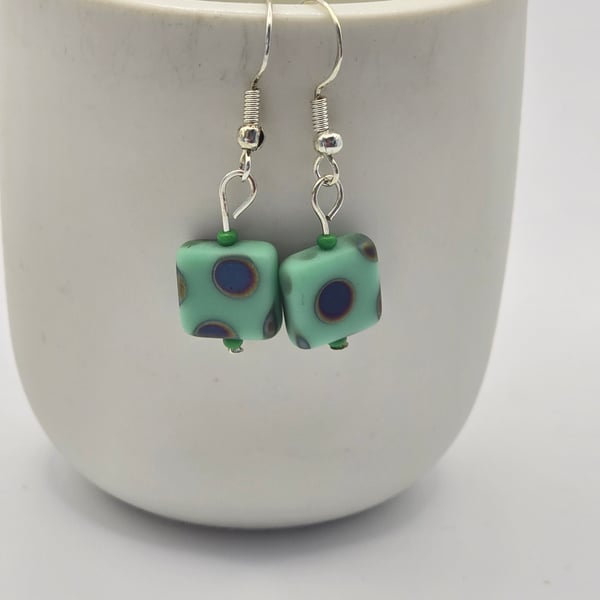 Czech Glass Green cubed earrings with a peacock pattern