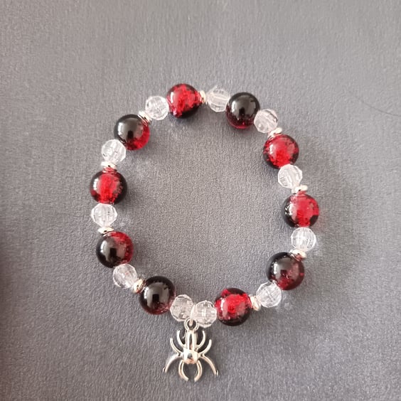 Elasticated handmade spider charm bracelet with red & black and clear beads