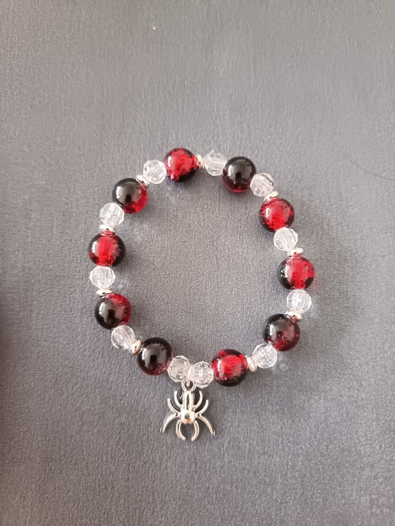 Elasticated handmade spider charm bracelet with red & black and clear beads