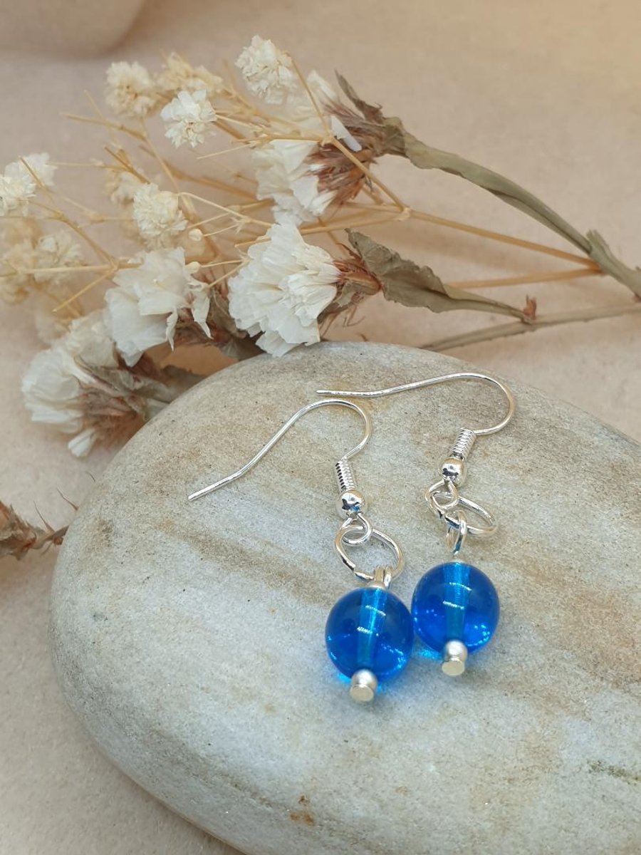 Lovely silver  plated earrings with beautiful blue azure blue glass beads 